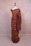 Brown cotton saree with leaf print, draped on mannequin - Seematti