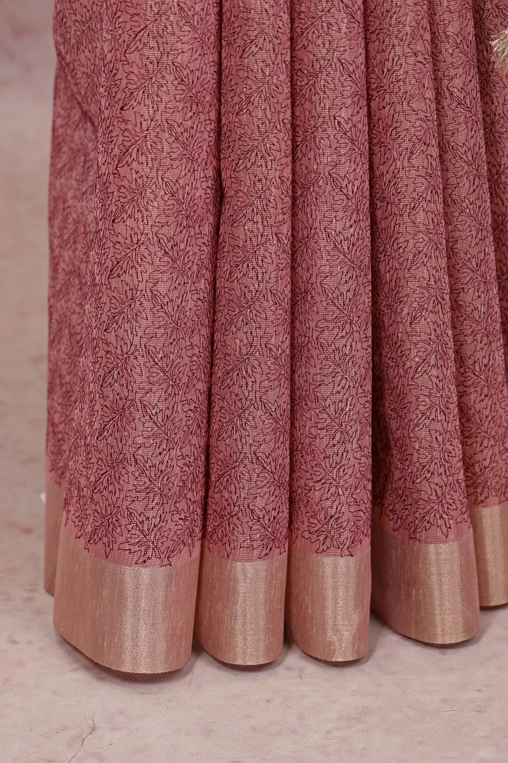 Light Onion Pink Semi Tissue Saree fabric spread, zari border detail