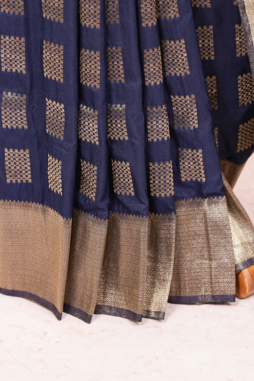 Navy Blue Semi Banarasi Saree fabric spread, gold zari check with designer border
