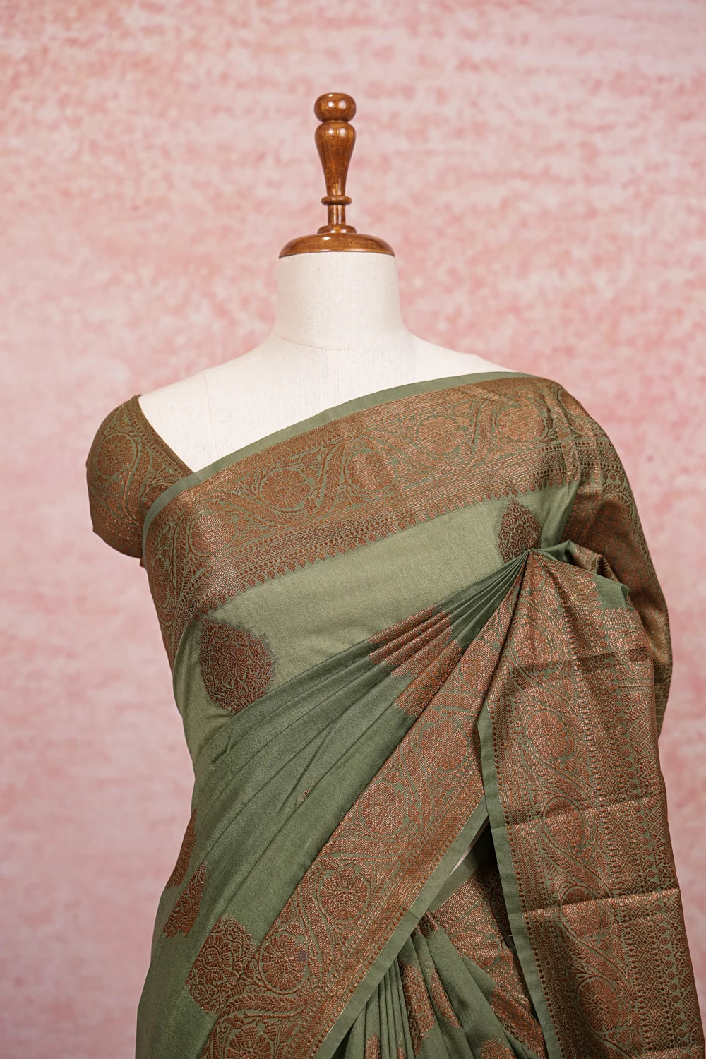 Green Semi Banarasi Saree pallu close-up, gold butta motifs on olive fabric