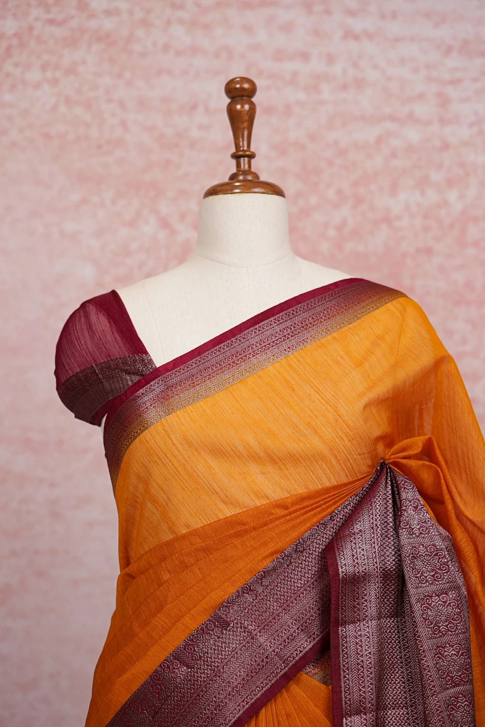 Mango yellow jute saree pallu close-up with zari border