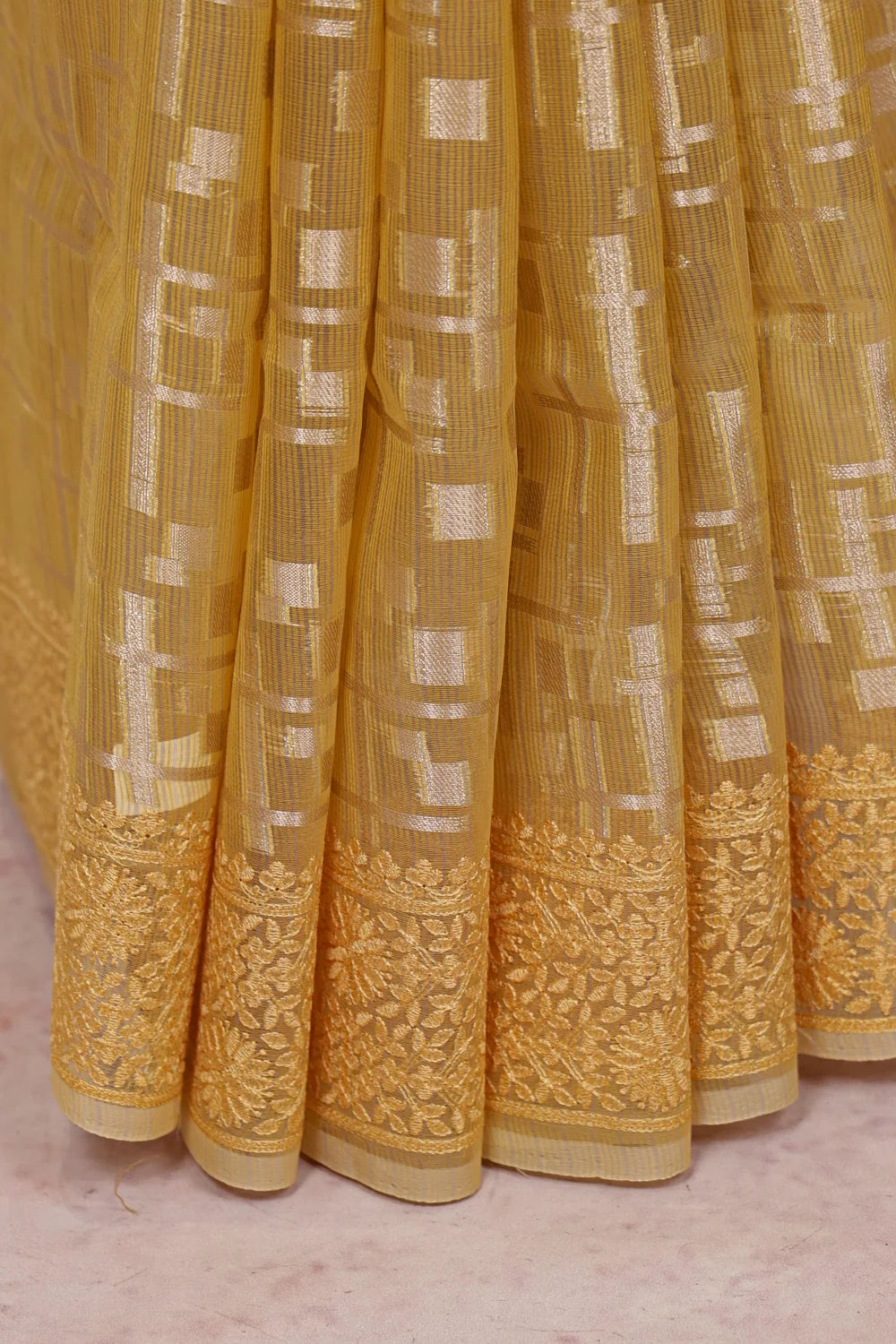 Light Yellow Tissue Kota Saree fabric spread, thread border detail