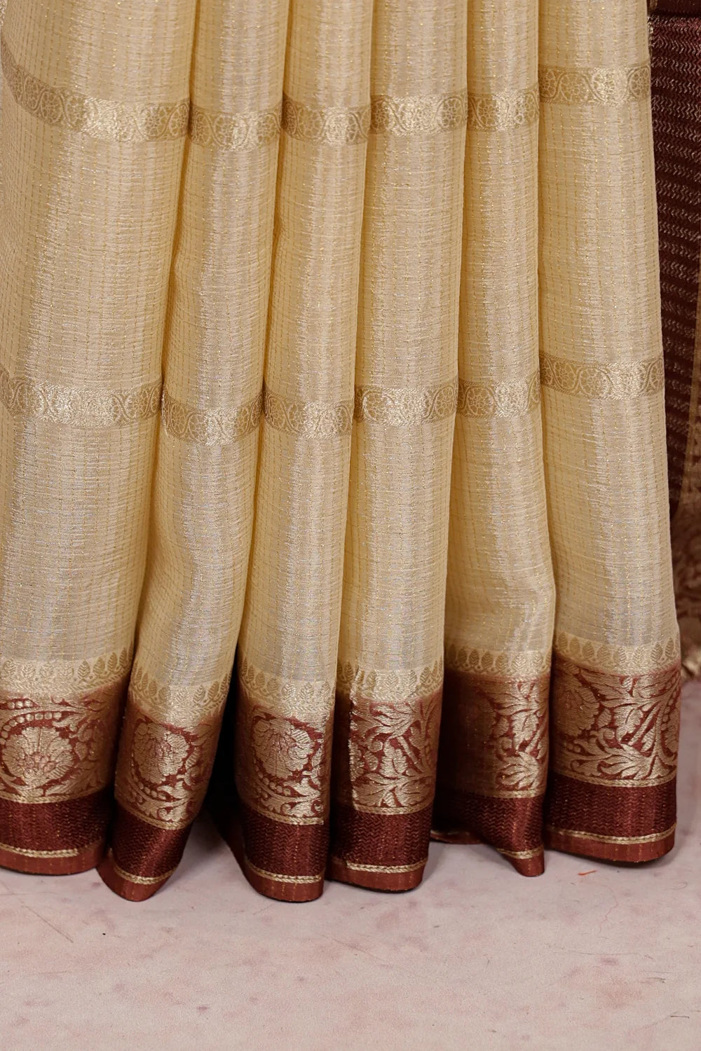 Cream Binni Silk Saree fabric spread, designer border detail