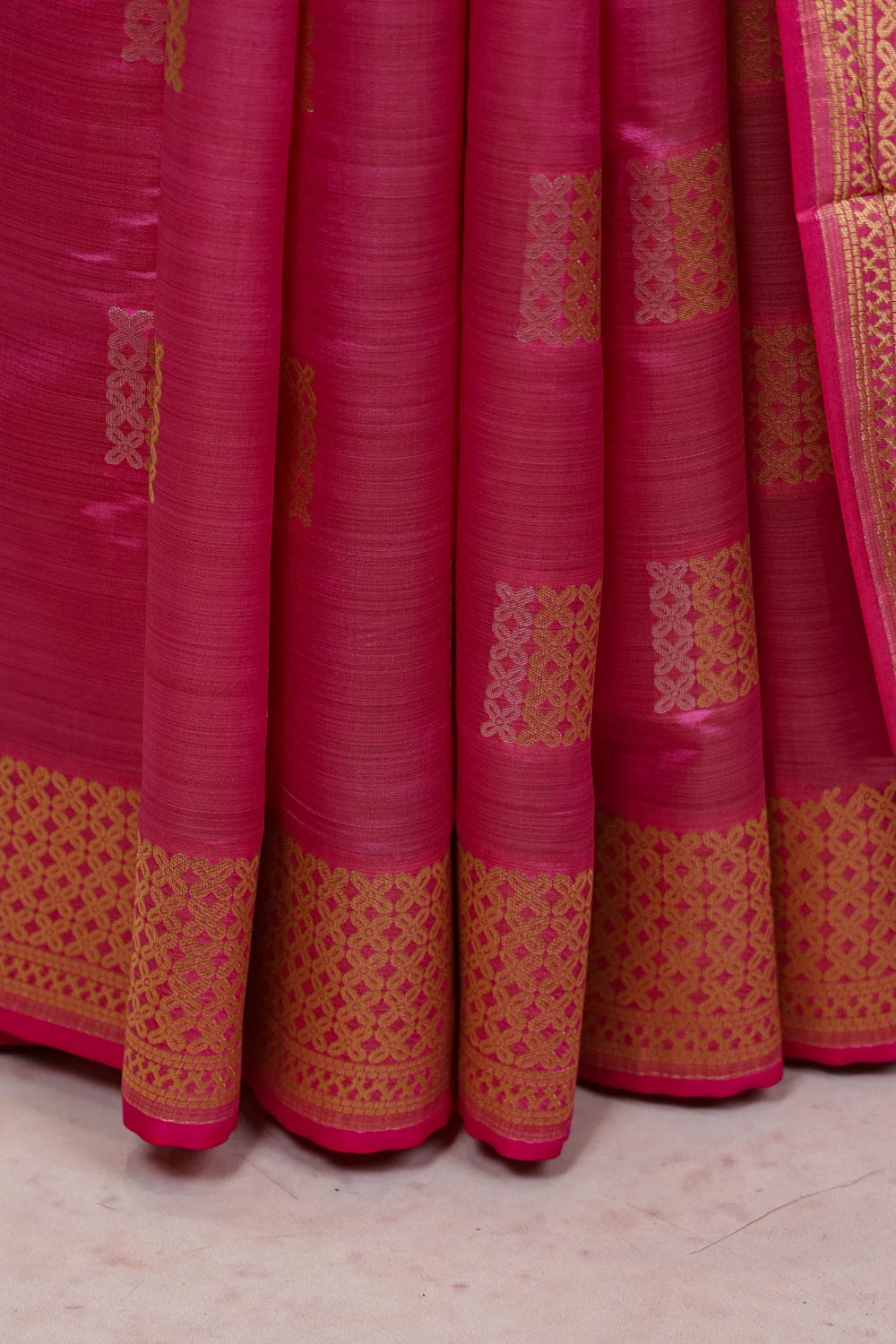 Magenta Pink Art Silk Zari Work Saree fabric spread, zari border detail