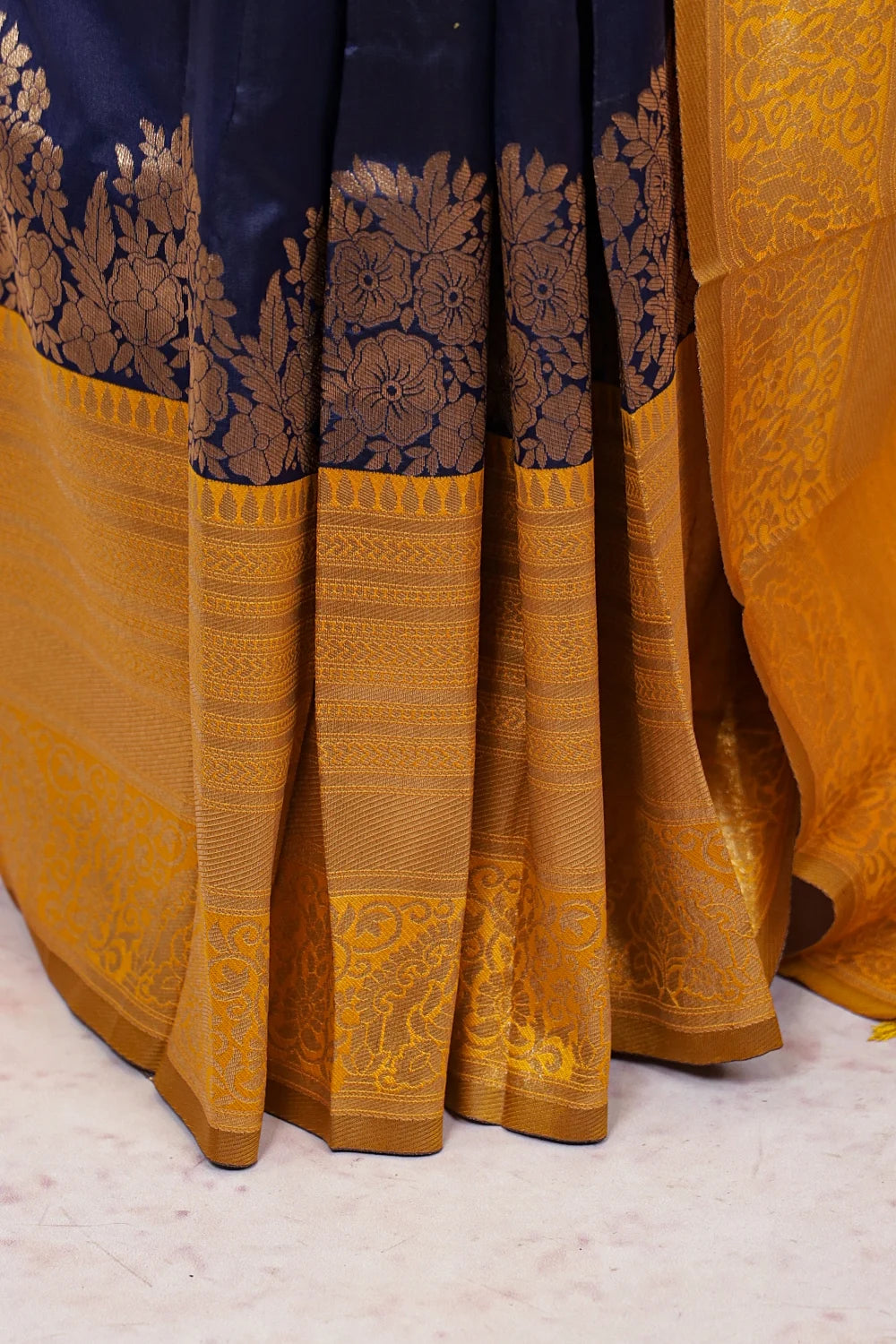 Navy blue art silk saree fabric spread, double border detail
