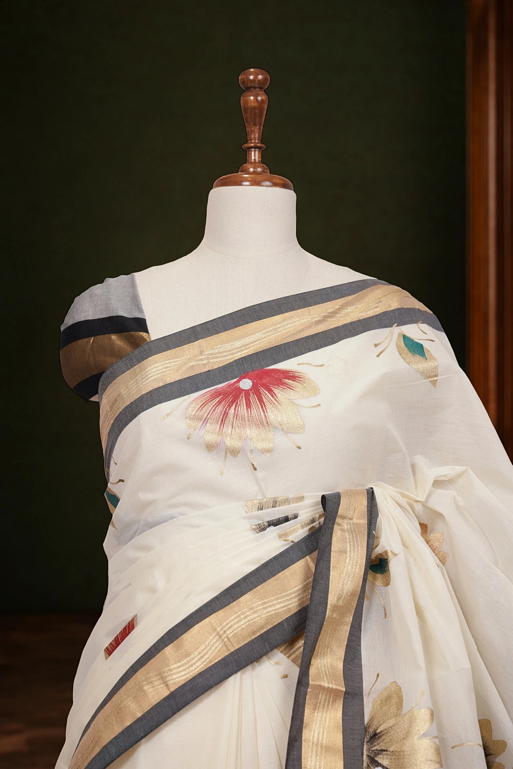 Kerala saree pallu close-up with painted floral design