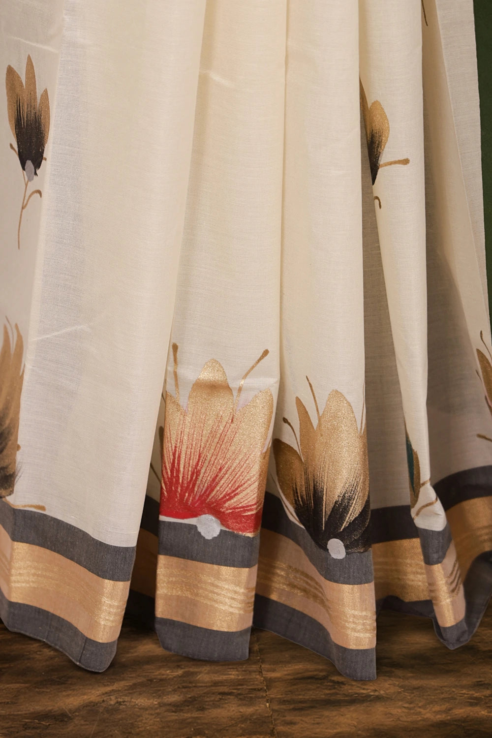 Off white Kerala saree fabric detail, painted florals with gold vine