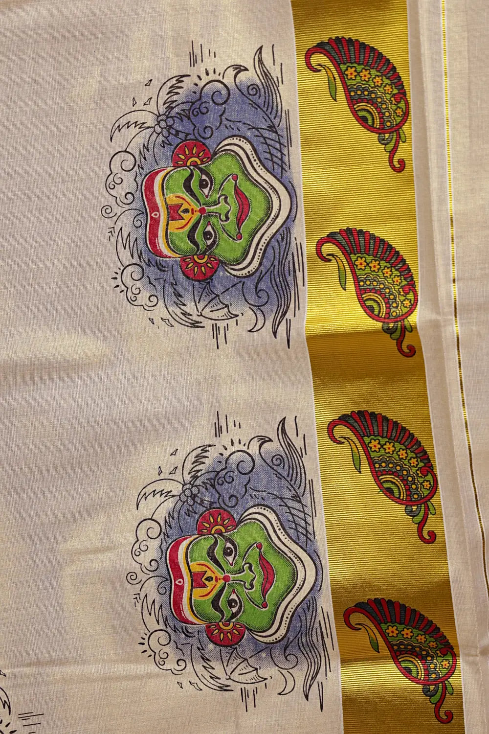 Golden Tissue Kerala Saree fabric spread, paisley border and Kathakali design