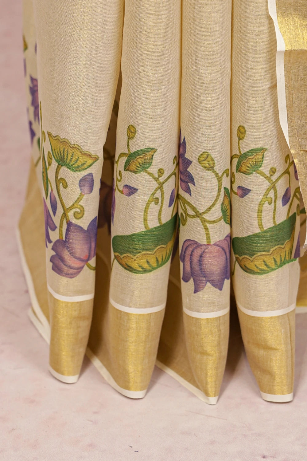 Golden Tissue Kerala Saree pallu spread, lotus vine floral design