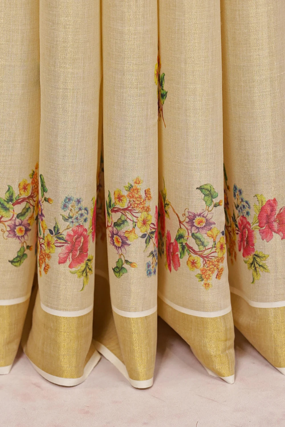 Golden Tissue Kerala Saree fabric spread, floral border design