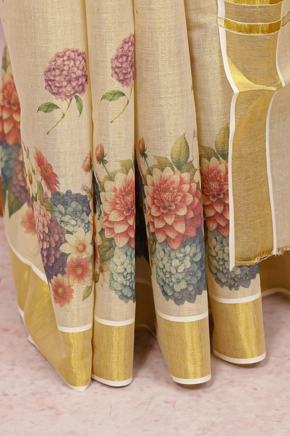 Golden Tissue Kerala Saree pallu spread, vivid floral bouquet design