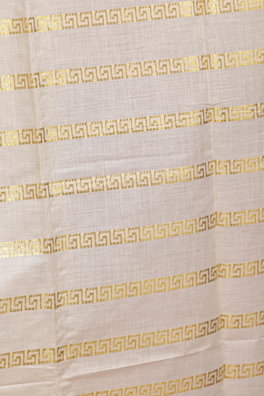 Cream Cotton Kerala Saree fabric spread