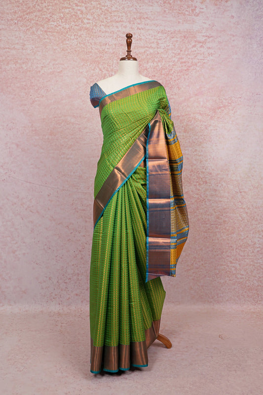 Parrot Green Semi Silk Saree with copper border, draped on mannequin - Seematti
